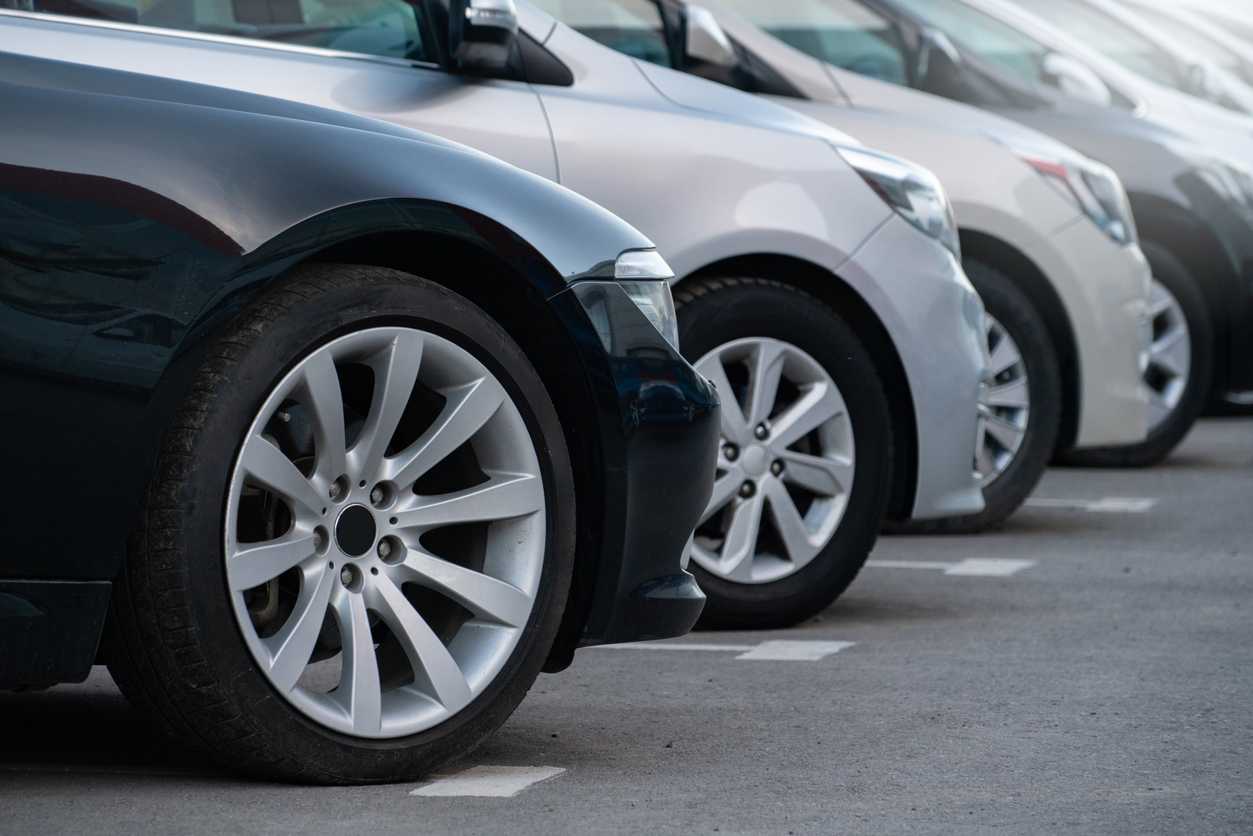 A lot of cars in a rows. Used car sales